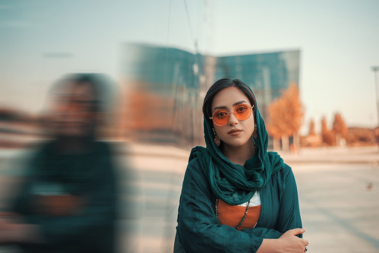Photo by Milad Shams woman in teal scarf